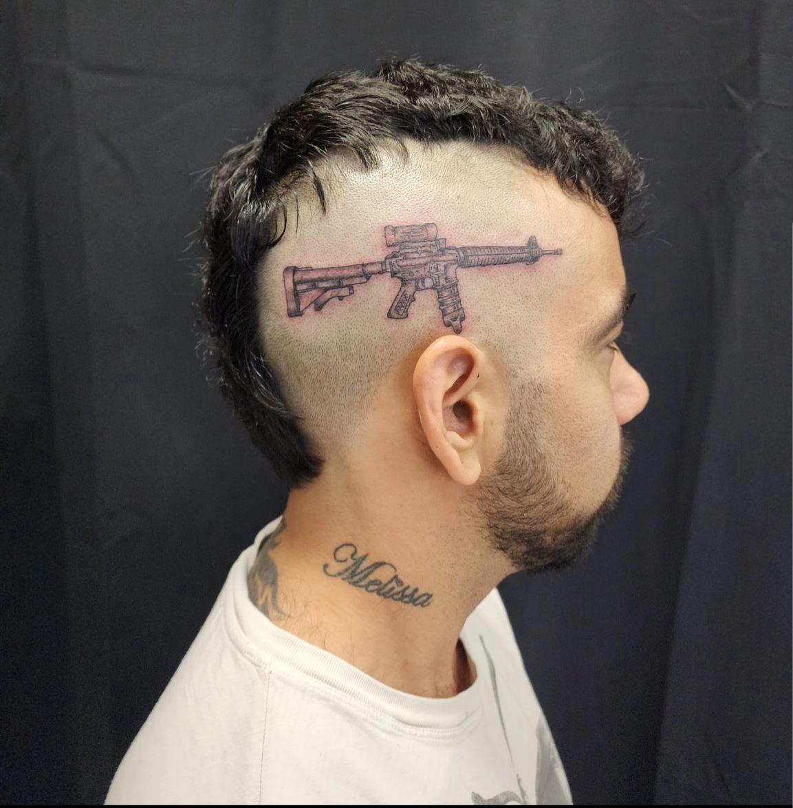 Keith Ono, gun tattoo, Nationalist-13